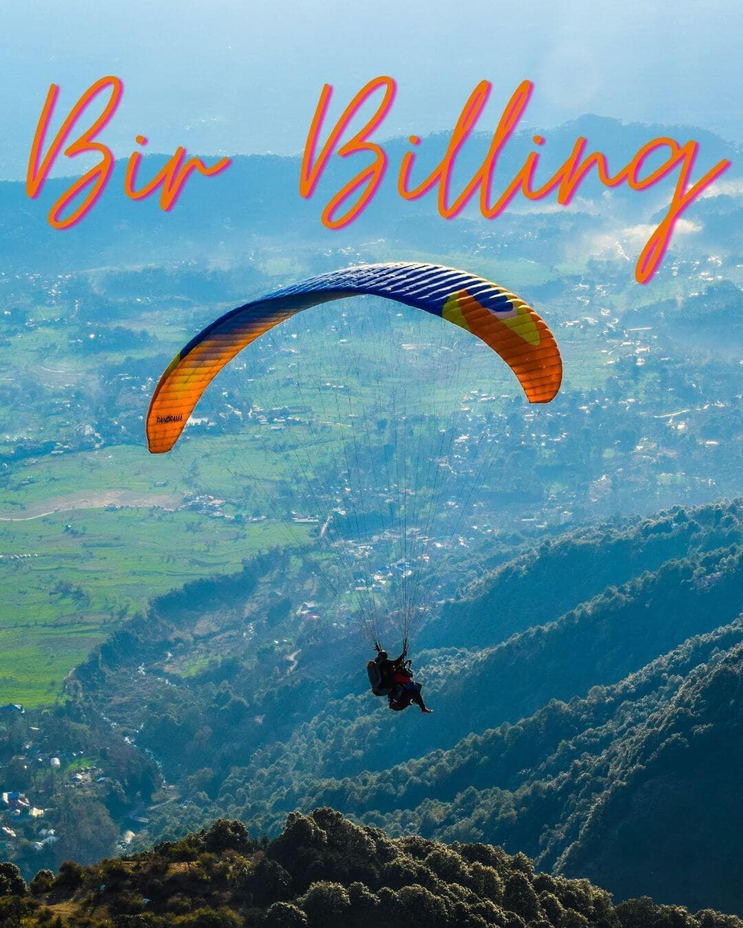 A paraglider soaring over the Kangra Valley at Bir Billing, Himachal Pradesh