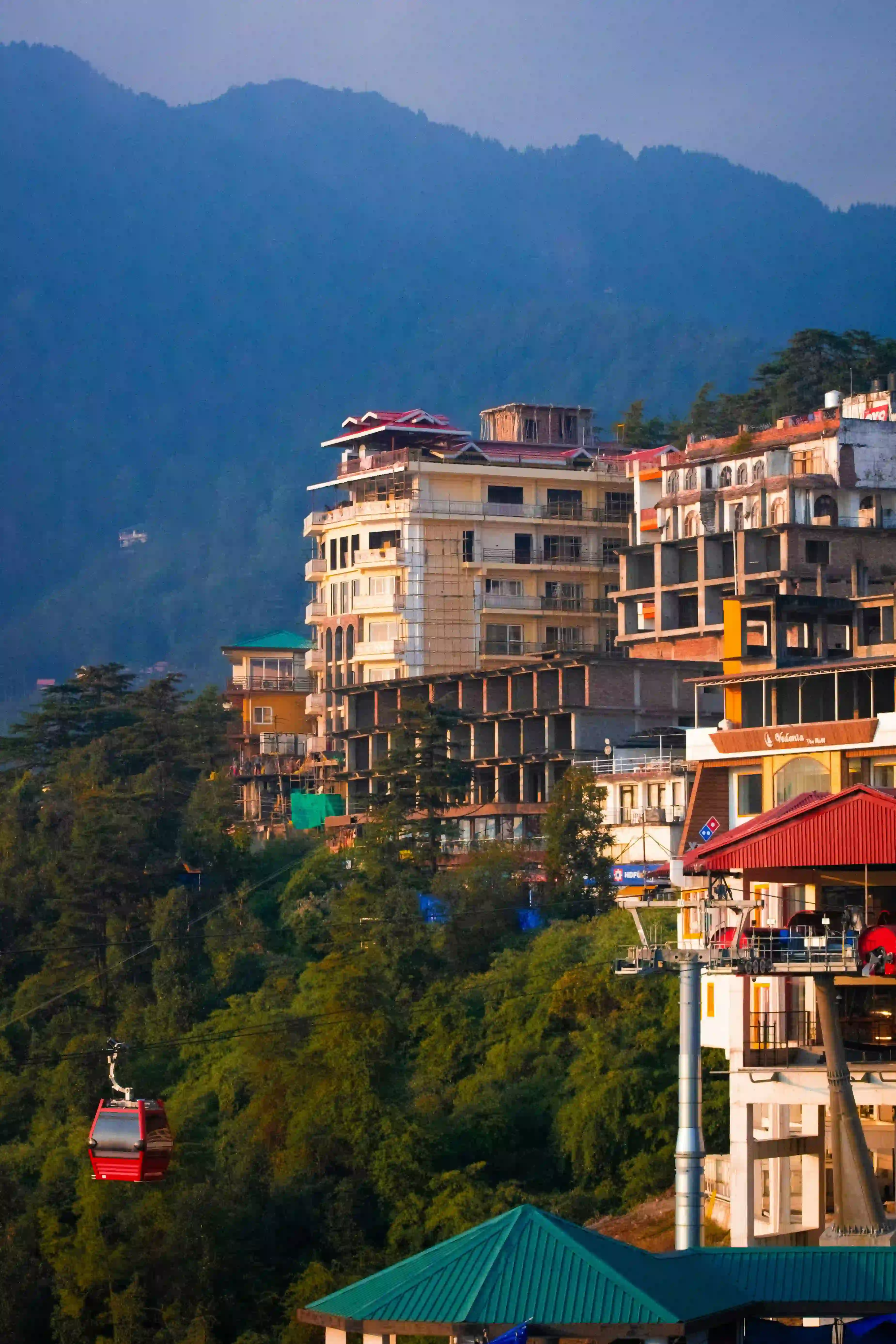 Trekker on the trail to Triund with Dhauladhar views