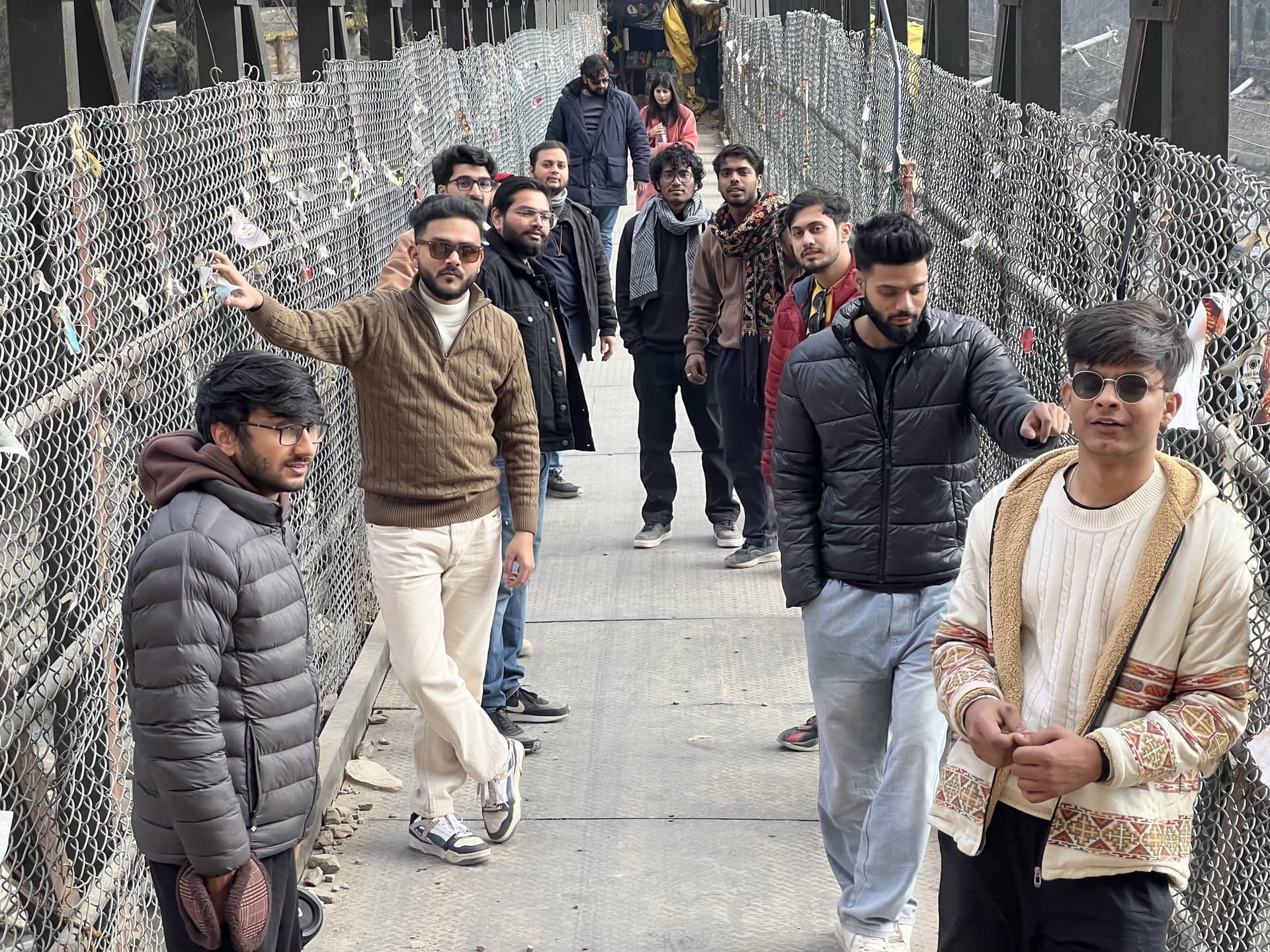 A TripoMusafir group safely crossing a river bridge with their trip captain